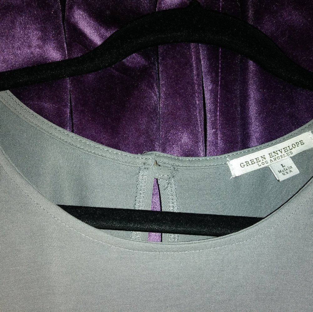 Green envelope-grey blouse